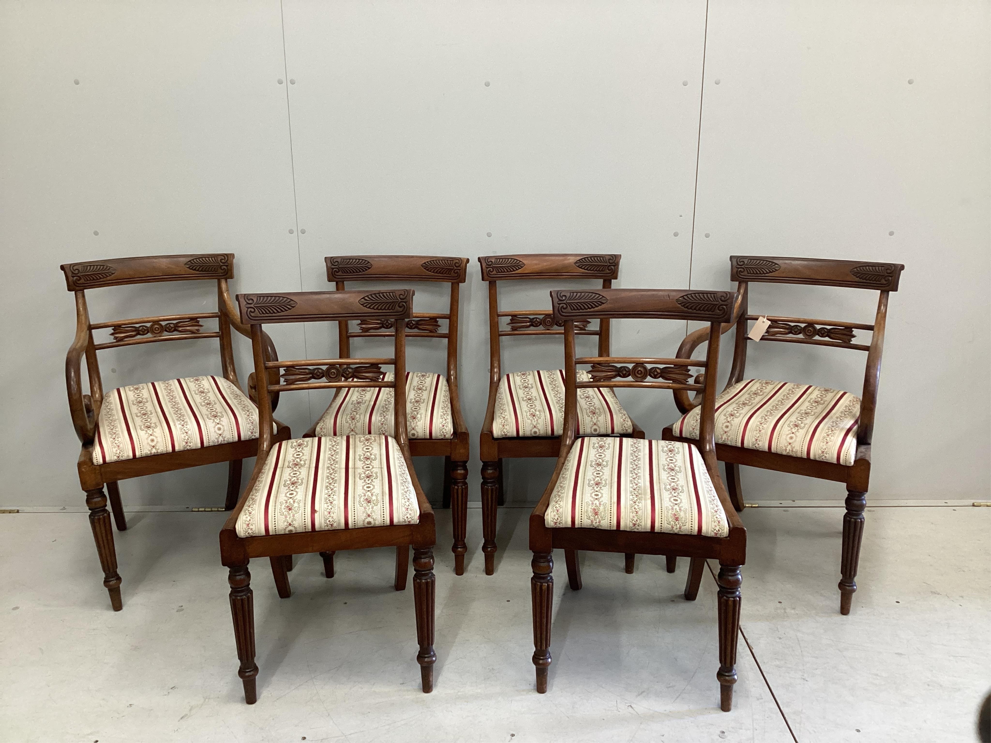 A set of six Regency mahogany dining chairs, two with arms